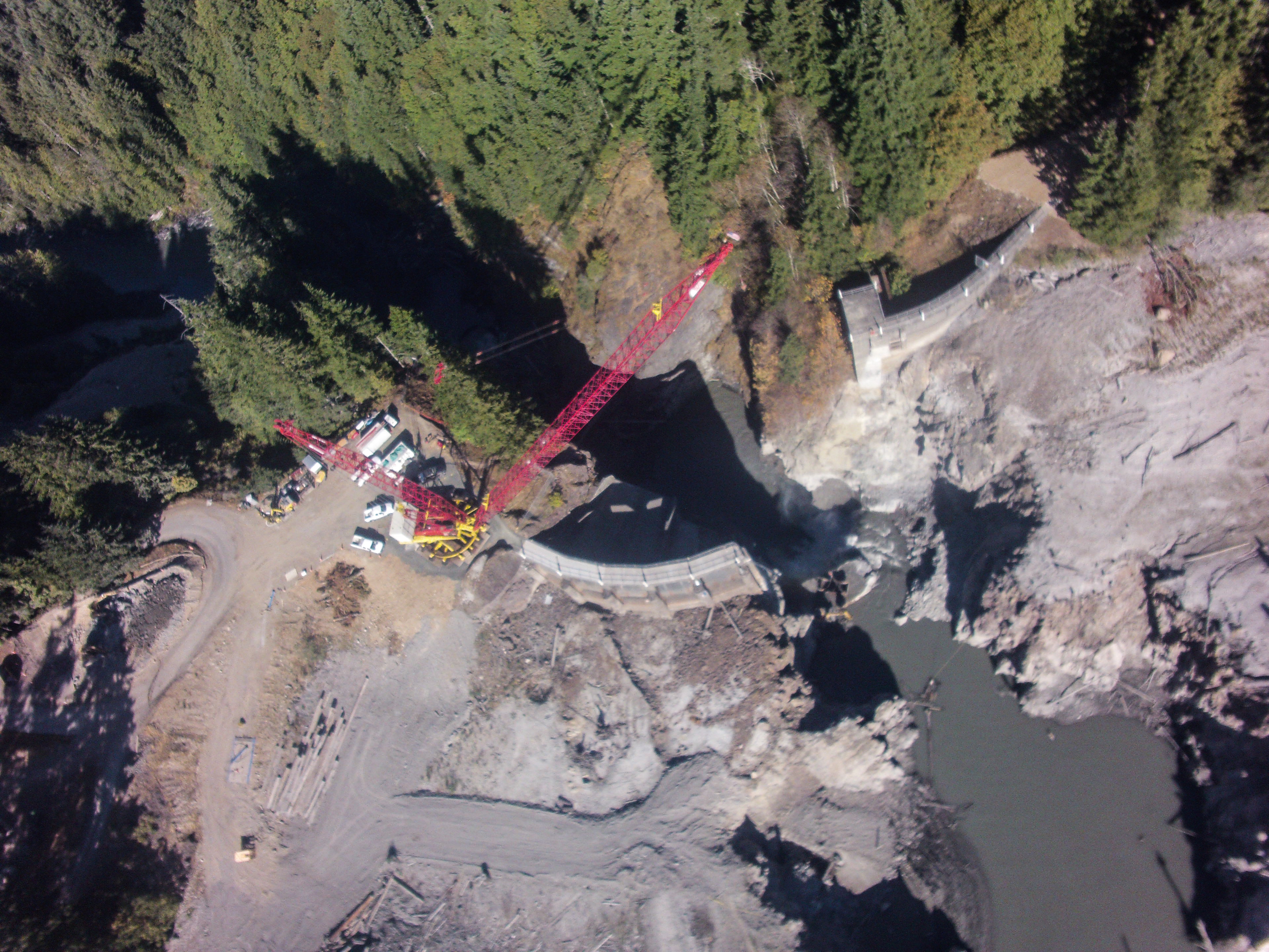 Aerial view of cranes and demolition at Glines Canyon Dam